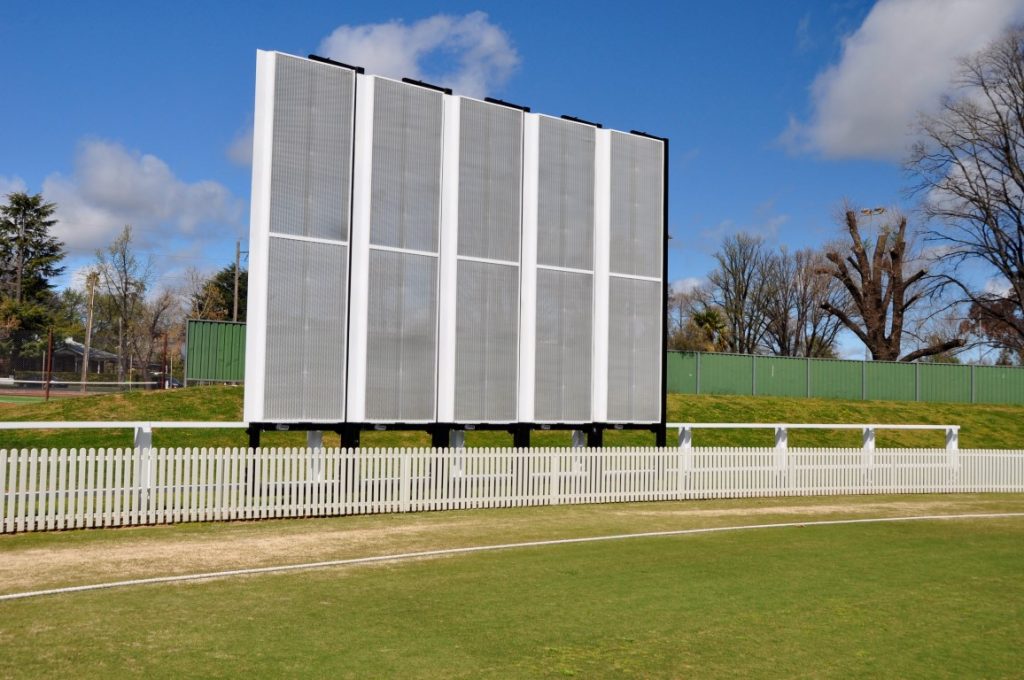 Cricketer facing bowler with side screen